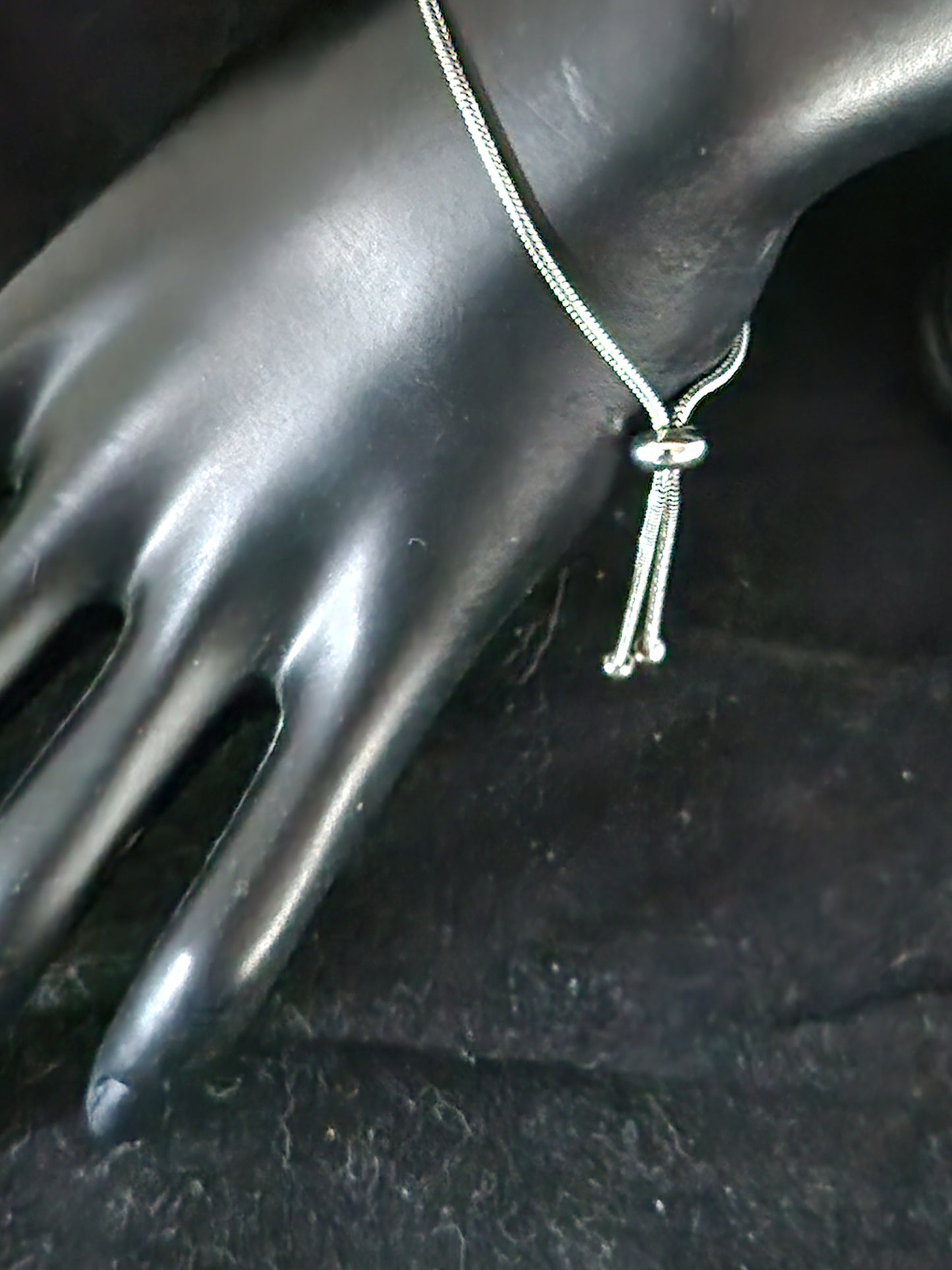 LARGE STERLING SILVER BEAD OVER HEMATITE ON AN ADJUSTABLE SILVER CHAIN