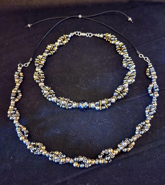 ADJUSTABLE TRIPLE TWIST NECKLACE WITH 18k GOLD, STERLING SILVER AND GRAY HEMATITE